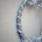 details of silver fleck polyester yarn wrapped hoop, it is then wrapped with one strand of gray cotton yarn giving the look of striped candy